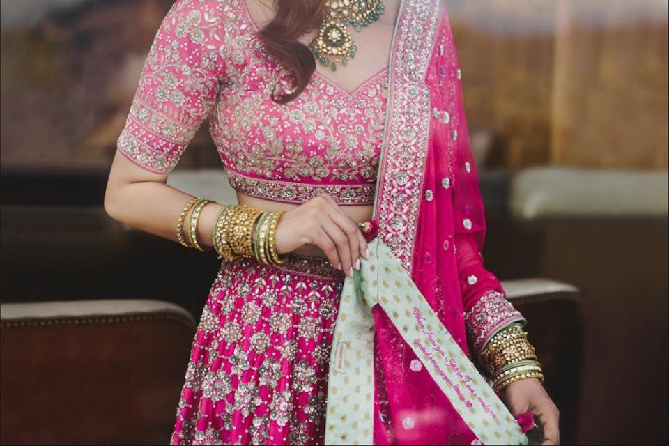 Onion Pink lehenga with embroidered blouse and cape.