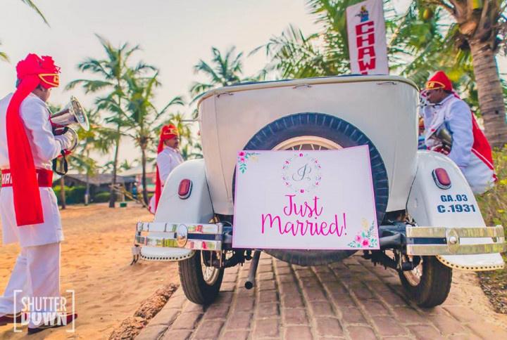 Just married board on a wedding car