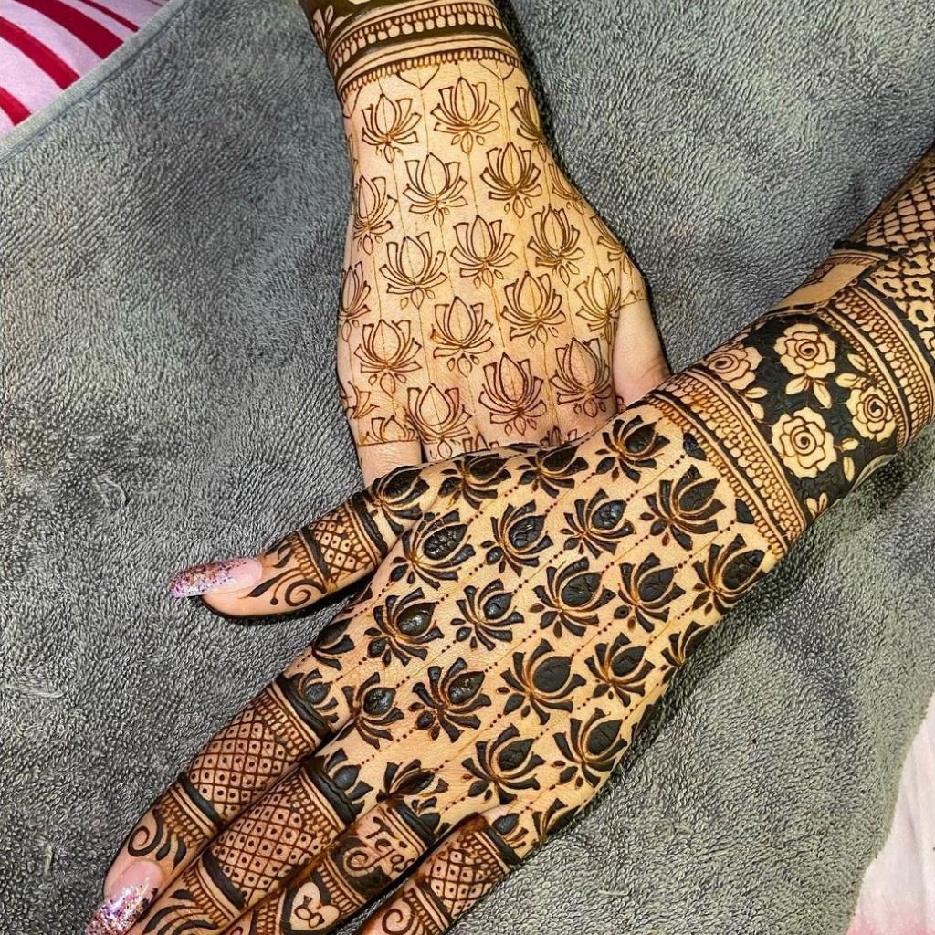 Artist applying henna tattoo on women hands. Mehndi is traditional Indian  decorative art, Hand with floral mehendi. Beauty drawing for weddings and  Stock Photo - Alamy