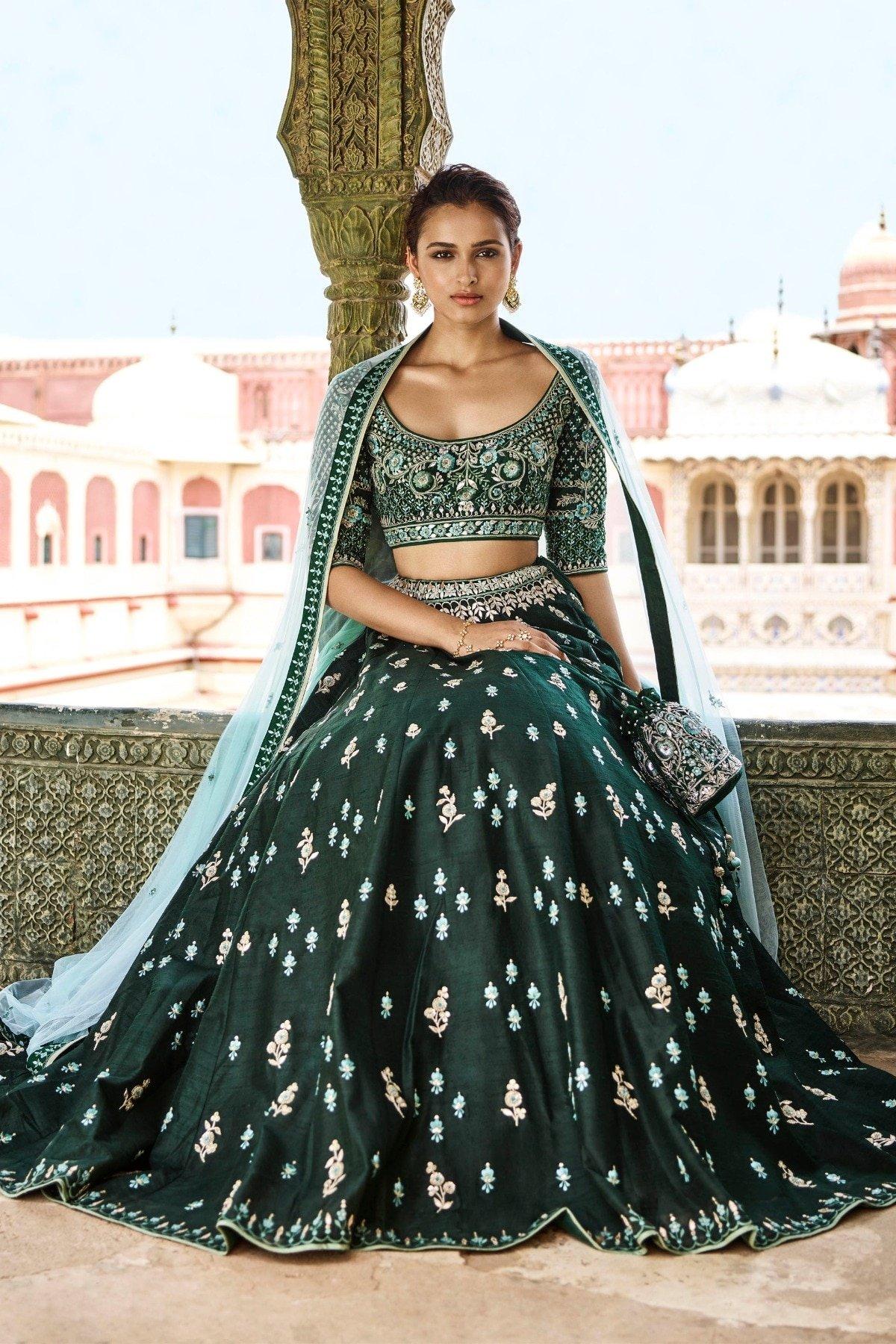 What colour lehengas would look good on a slight dark complexion bride for  an evening reception? - Quora