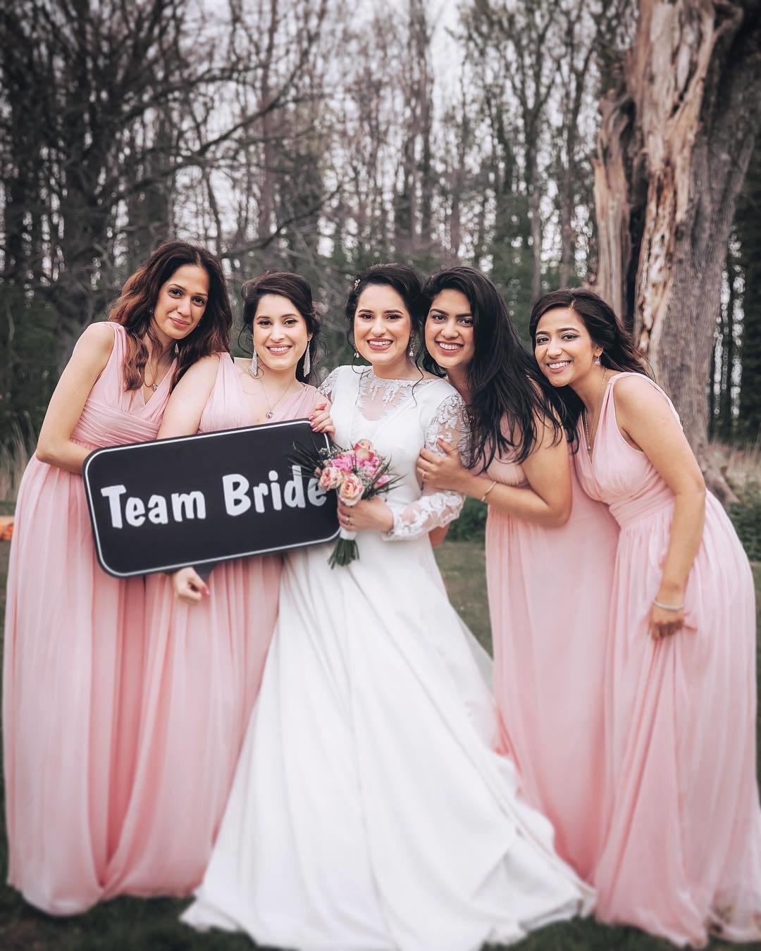 Virginia bride poses with bridesmaids in black bridesmaids dresses