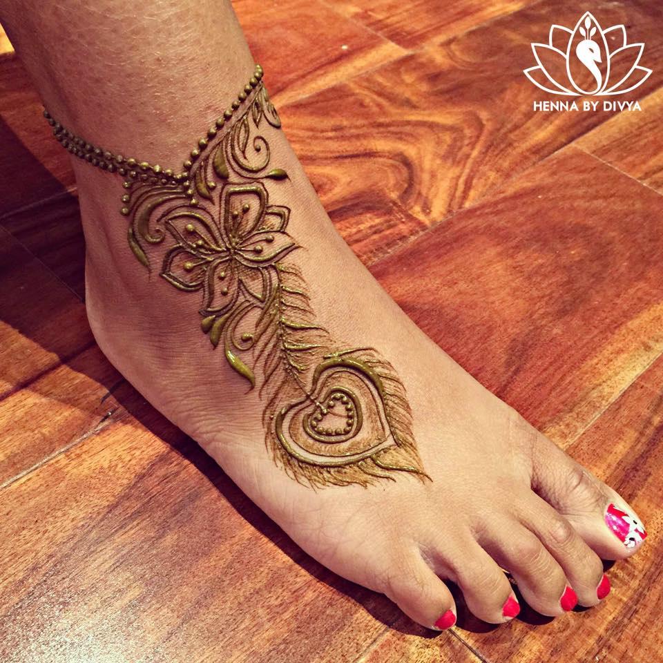 Intricate Henna Designs on Woman's Hand in Blue, Green and Gold stock photo  | Creative Fabrica