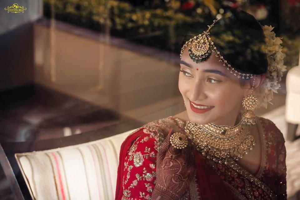 A Beautiful Bride in White Lehenga Wearing Maang Tikka on Her Forehead ·  Free Stock Photo