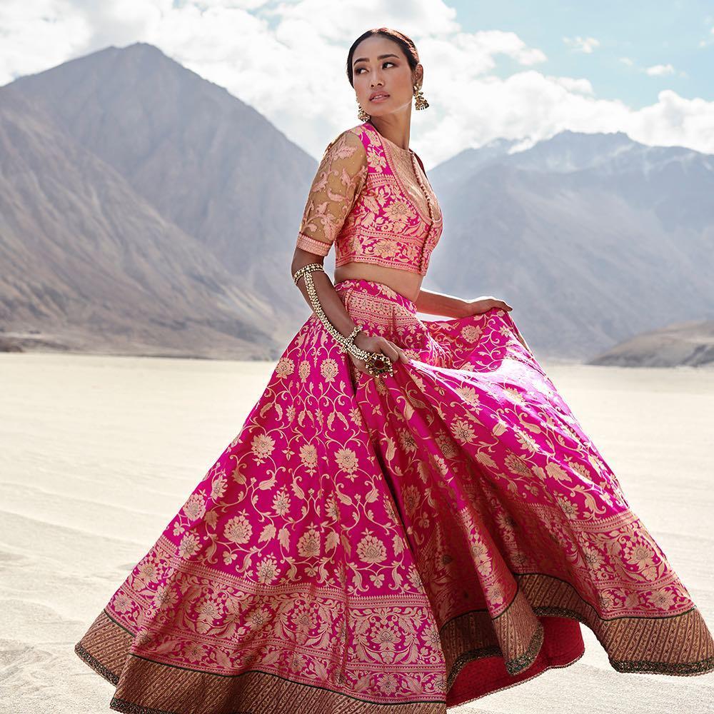 Peach embellished lehenga set designed by Ritu Kumar at AASHNI+CO.