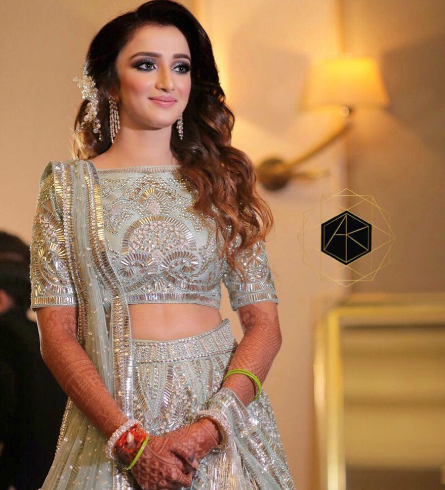 Photo of White and gold light lehenga for sister of the bride