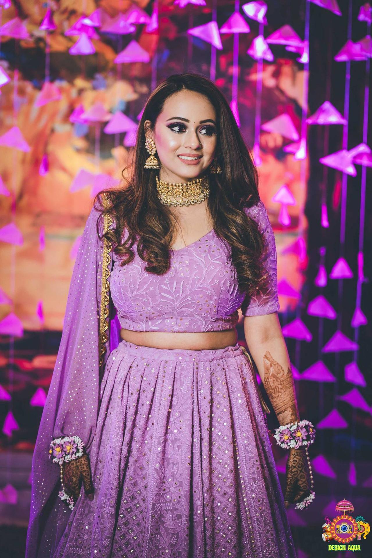 Photo of Indian bride wearing cold shoulder blouse with tassels with unique  gold choker necklace