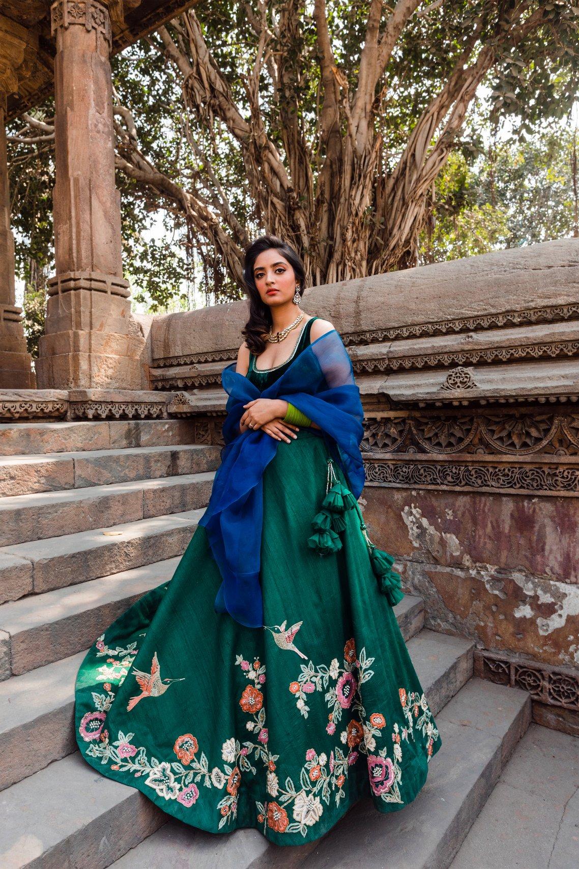 SHYAMAL & BHUMIKA - The Ethereal Verdant Green Lehenga is abloom with  Flowers and Chirping Birds. A Coral Blouse and Dupatta complete the finely  handcrafted ensemble Kindly WhatsApp us on +91-9833520520 for
