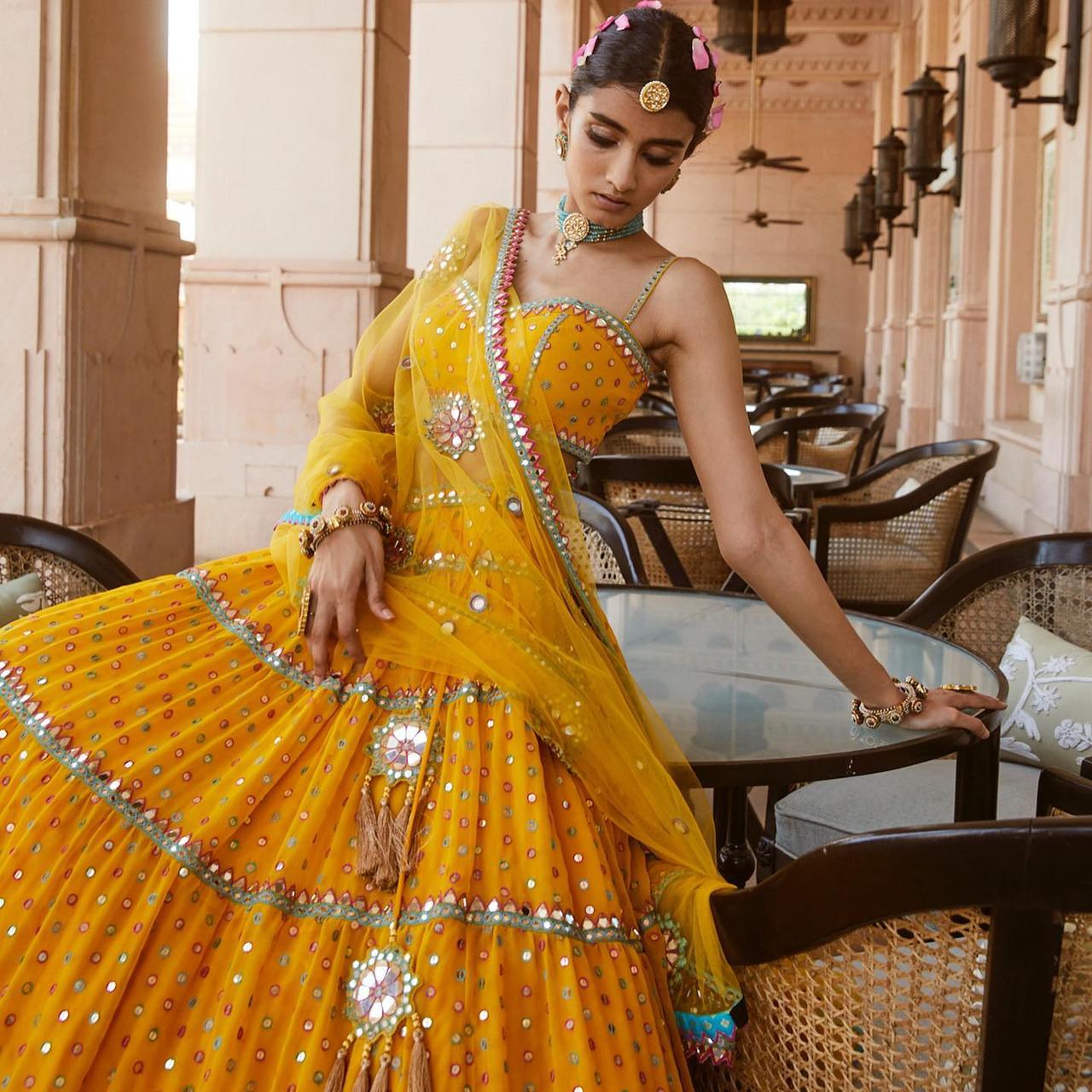 Yellow Blouse with Orange Mirror Work Lehenga - Shrena Hirawat - East  Boutique