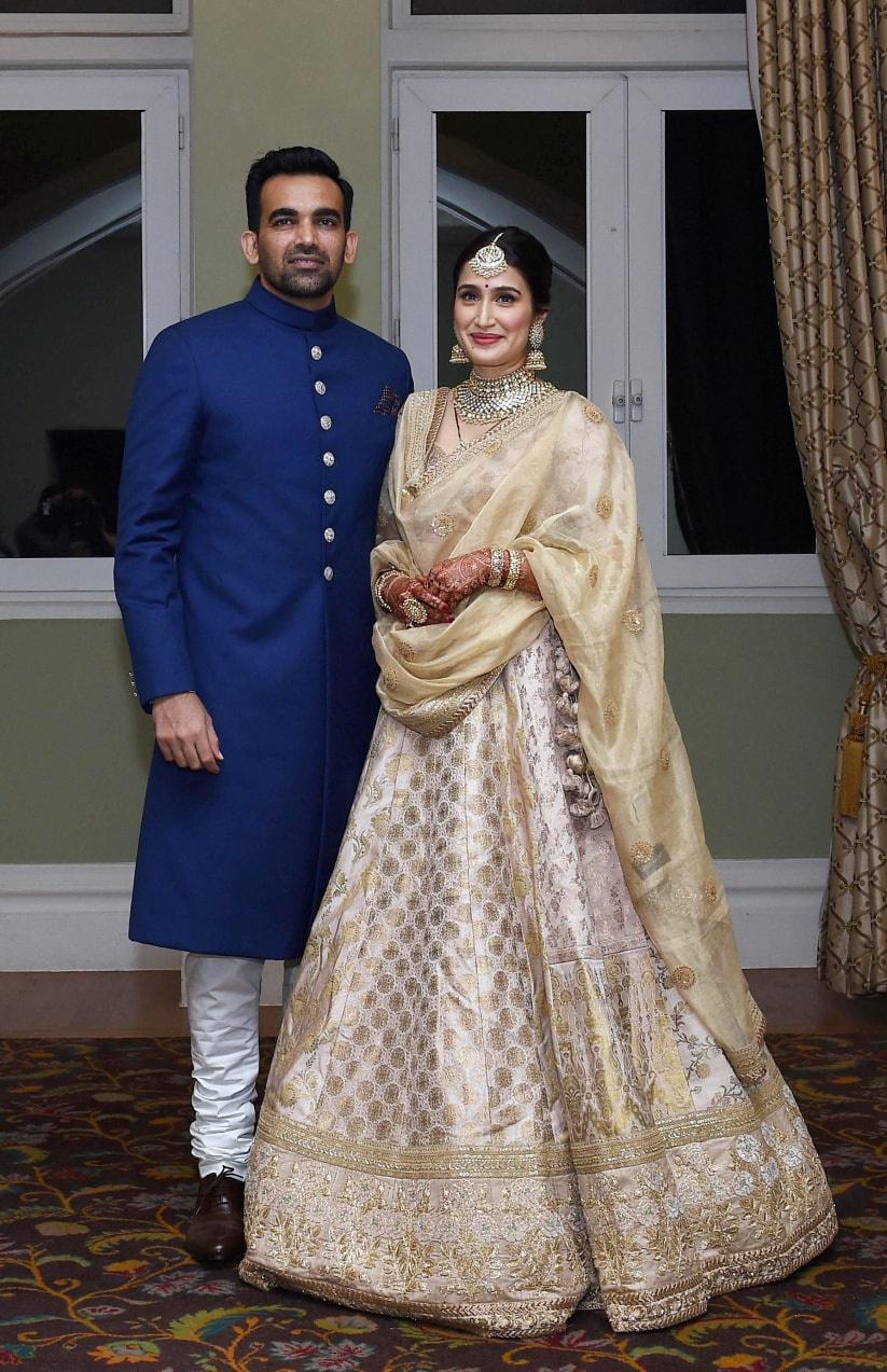 IVORY WHITE BANARASI LEHENGA SET WITH A MATCHING GOTA HANDWORK BLOUSE WITH  GOLD EMBELLISHMENTS AND A BANARASI DUPATTA. - Seasons India