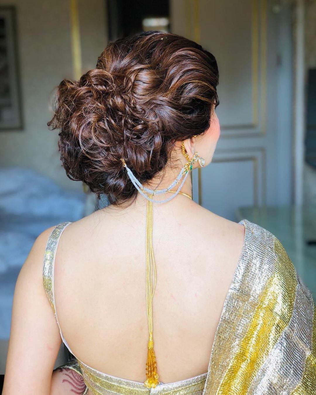 messy bun hairstyle for indian bride