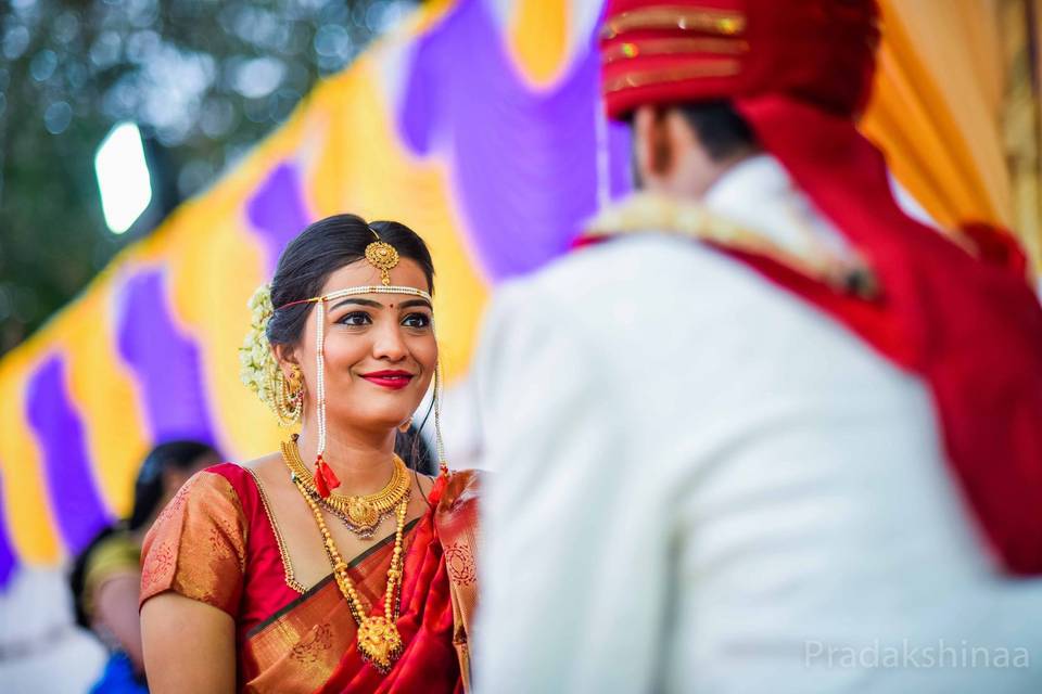 Photo of A Marathi bride in a purple saree with gold jewellery | Marathi  bride, Nauvari saree, Purple saree