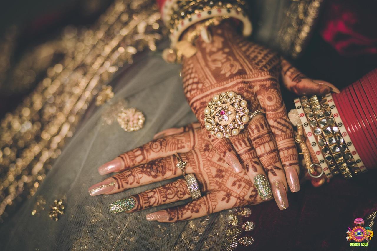 Close Up Of Left Hand Of Girl With Red Nail Polish And Mehndi Designs In  Fingers And Middle Of Hand Selective Focusing Stock Photo - Download Image  Now - iStock