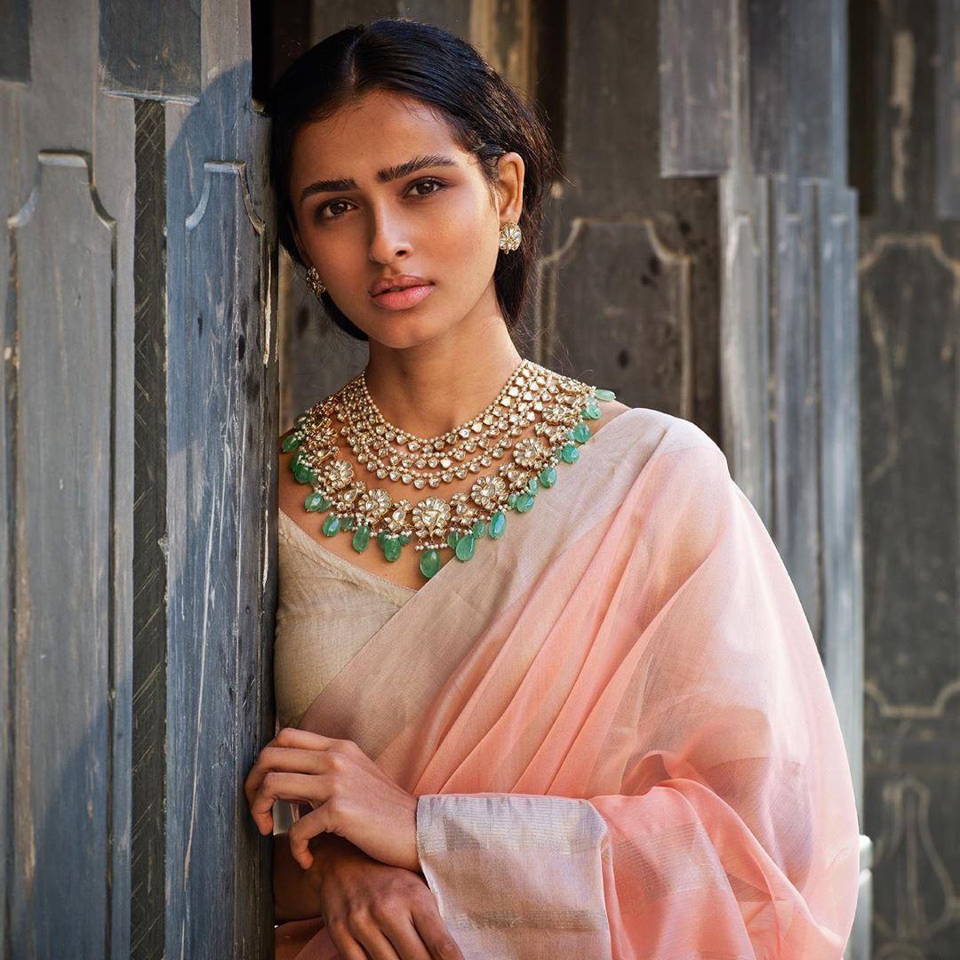 Beautiful Bride In Orange Outfit With Floral Jewellery - Shaadiwish