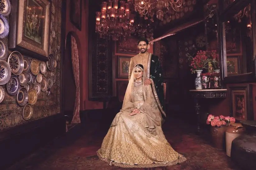 Photo of Muslim bridal look in red and gold lehenga