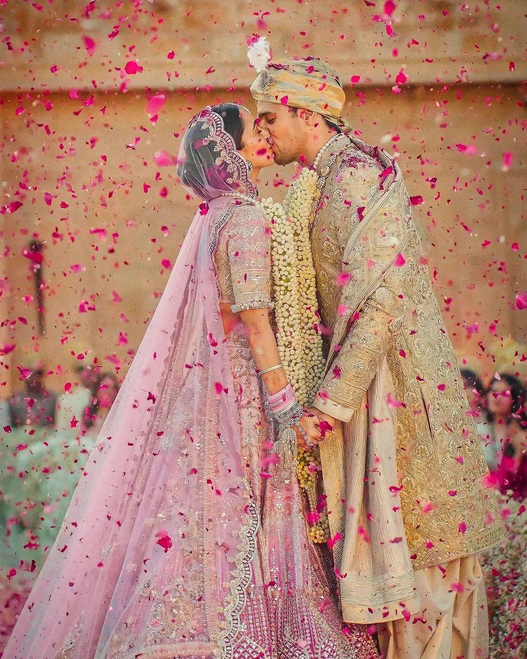 Candid Couple Shot - Bride in a Red Sequinned Lehenga and … | Indian  wedding photography poses, Wedding couple poses photography, Indian wedding  photography couples