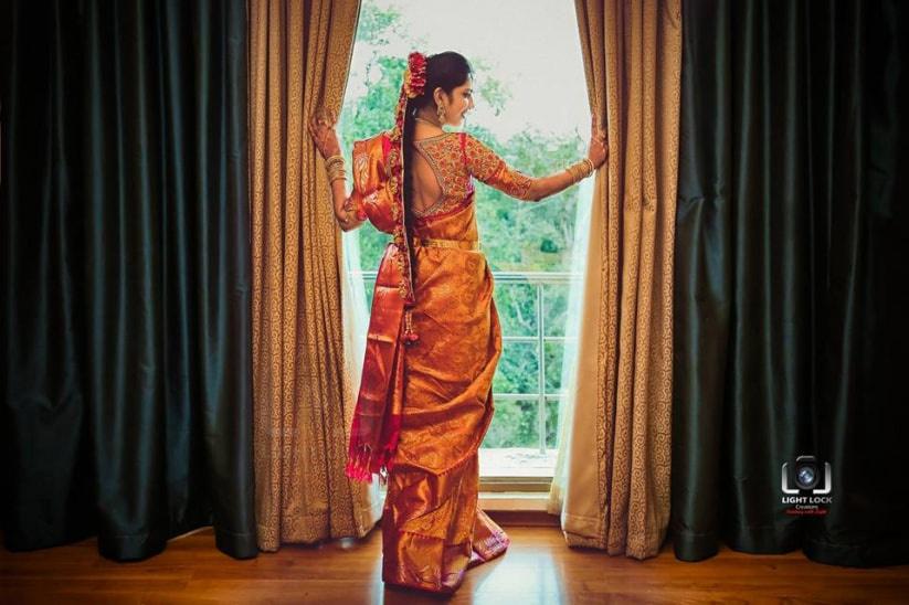 a bride in traditional indian attire poses for a photo with her  bridesmaids. AI-Generated 31256518 Stock Photo at Vecteezy