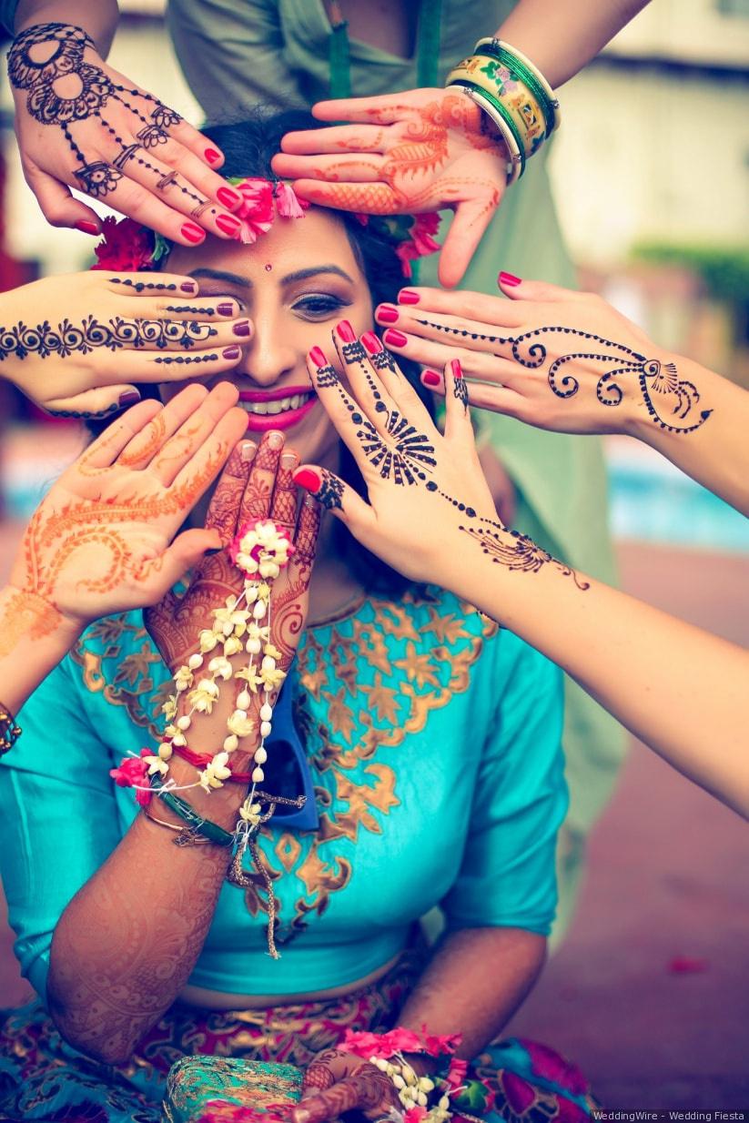 Pakistani & Indian bride wedding style showing Earring, Bangles & beautiful  Mehndi design Stock Photo - Alamy