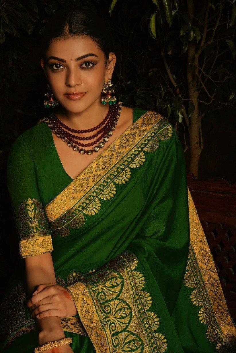 Photo of South Indian Bride wearing a white and green saree with temple  jewellery.