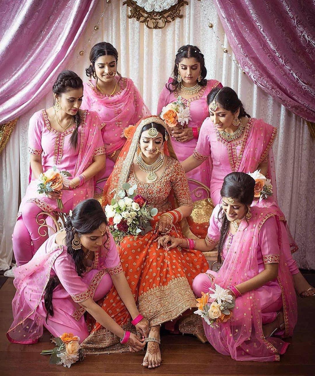 Sister of the Bride - Bride in a Red Bridal Lehenga and Sisters in a Pink  Lehenga wi… | Indian wedding photography poses, Wedding photoshoot poses,  Bride photoshoot