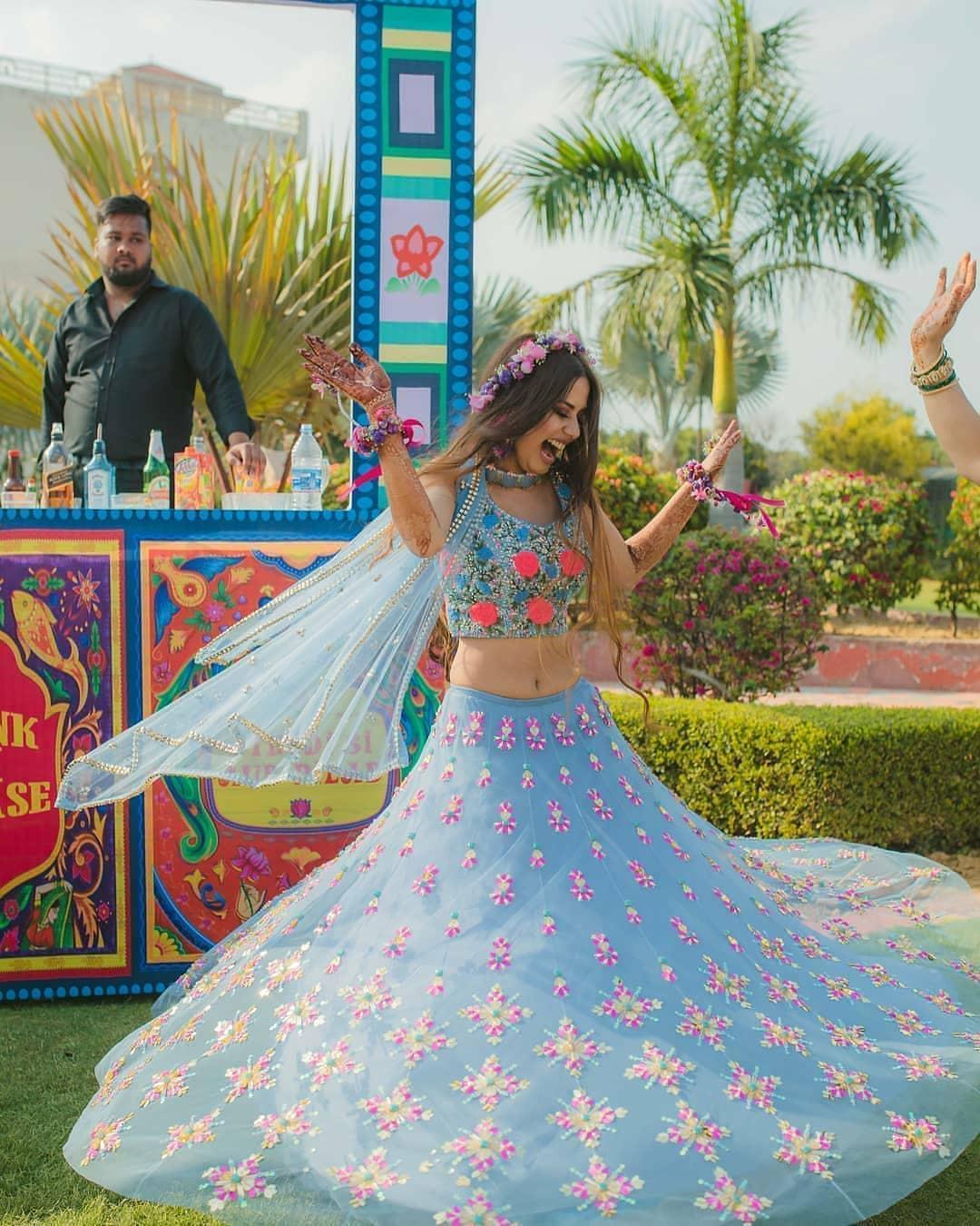 Photo of engagement lehenga in blue with light jewellery