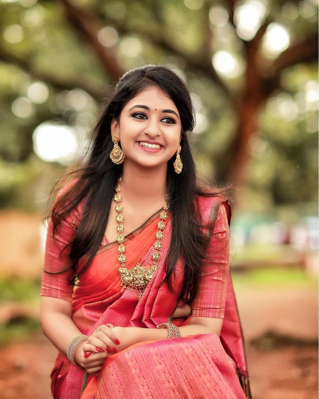 Photo of South indian pink saree with traditional south indian gold  jewellery