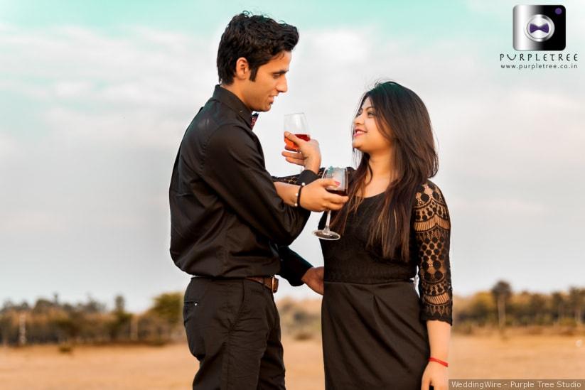 Premium Photo | The newlyweds are sitting on a chair and hugging tenderly.  girl with a boyfriend on a romantic date at sunset of the day. beautiful  couple in the field.