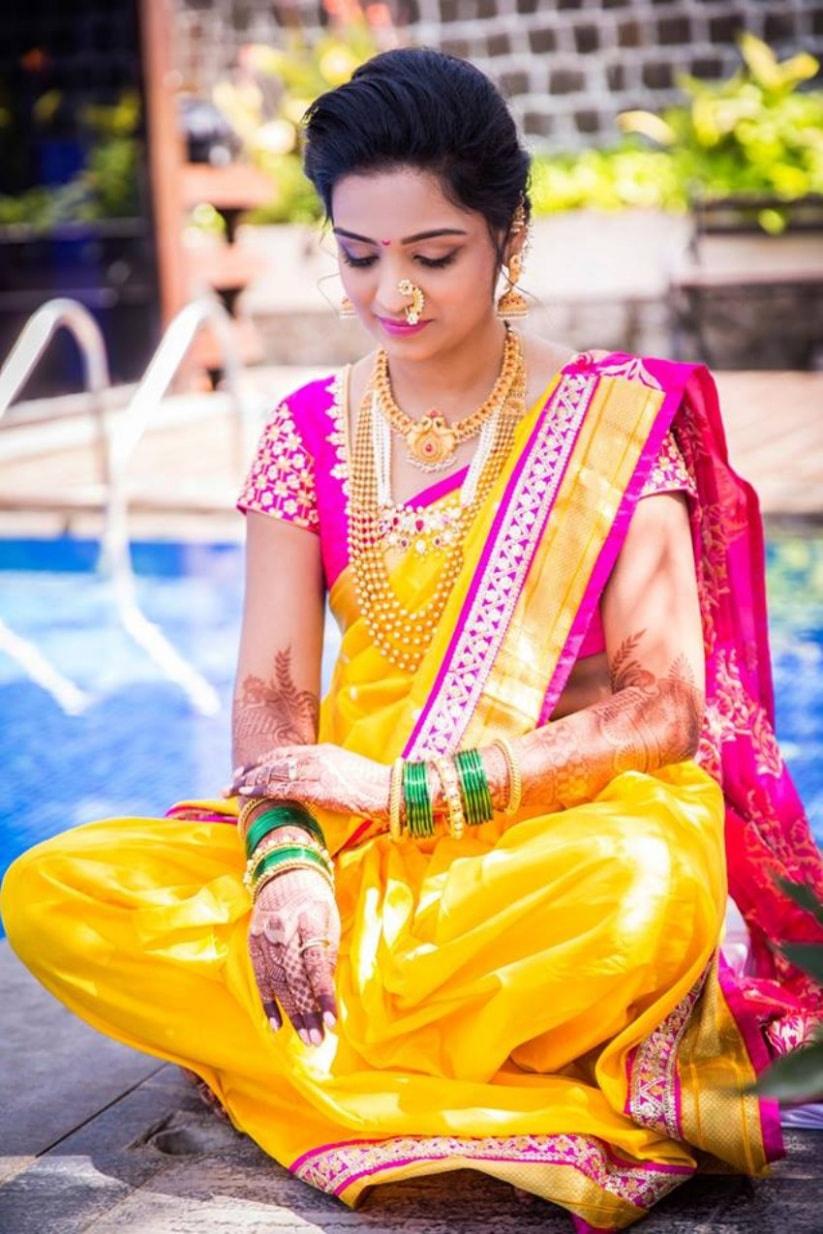 An opulent Marathi Wedding with the Bride in Gorgeous Outfits! |  WeddingBazaar