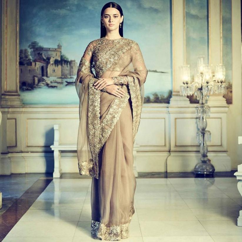 Sabyasachi - Come winter, we always present another house classic- our  velvet sarees. This year we present it in Burma Ivory with a painstakingly  embroidered 'tilla' work pallu inspired from a rare