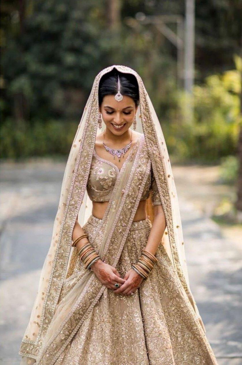 NITIKA GUJRAL' presents Gold Tulle Lehenga Choli Dupatta Set With Worked  Belt available exclusively at FEI