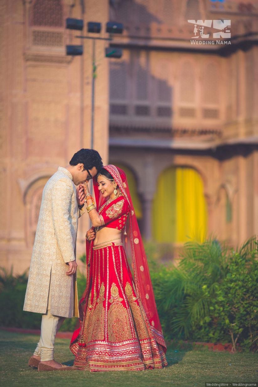 Ecstatic Resort Wedding of a Classy Couple in Designer Ensembles | Couple  wedding dress, Wedding photoshoot poses, Wedding couple poses photography