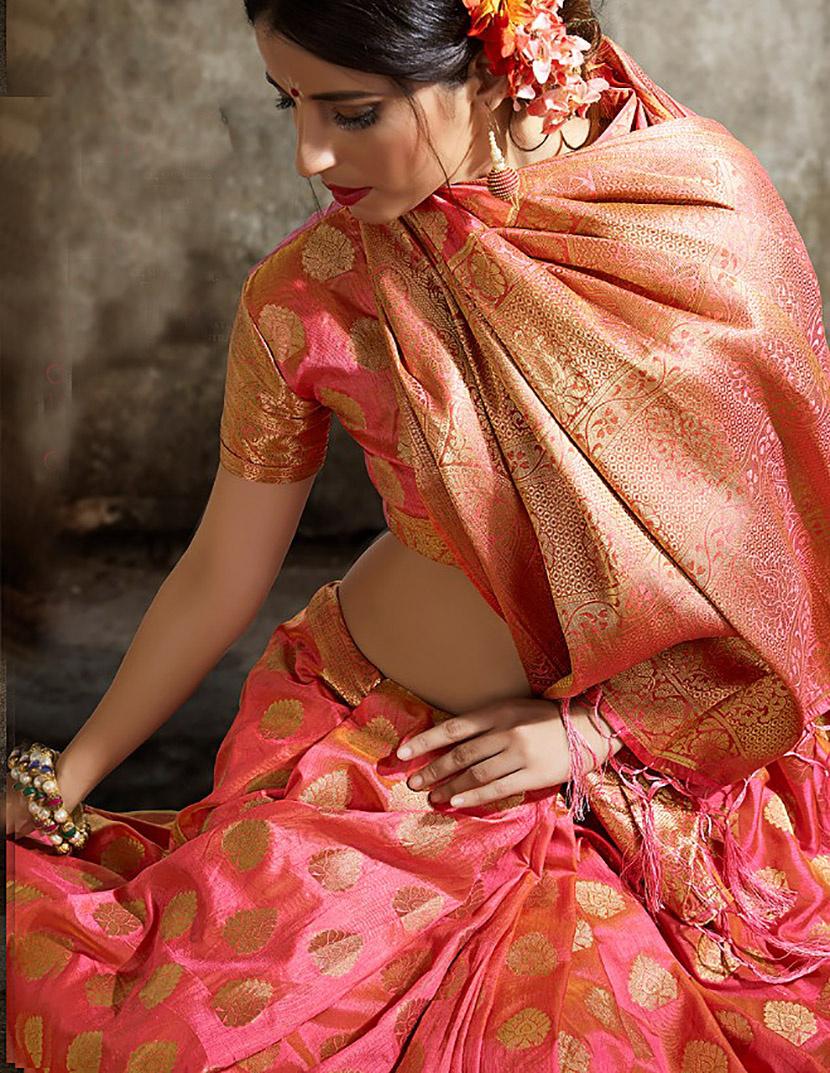 Sana's - Enjoy your summer brunches in this coral pink organza saree,  having monotone embroidery with mirror. Blouse having puff sleeves and  oversized bow at back. Available in stores and online.  https://sanas.pk/products/sr202121