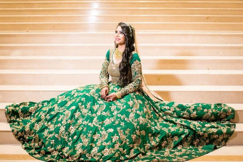 Gorgeous vintage style Indian bride sitting in a luxury hotel room wearing  traditional lehenga with ghungat 24754166 Stock Photo at Vecteezy