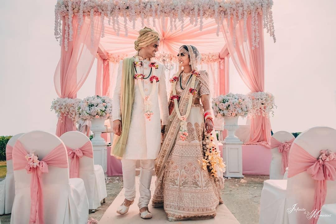 Groom in Gold, Navy Sherwani and Bride in Ornate Lehenga in Elegant  Hallway, Art