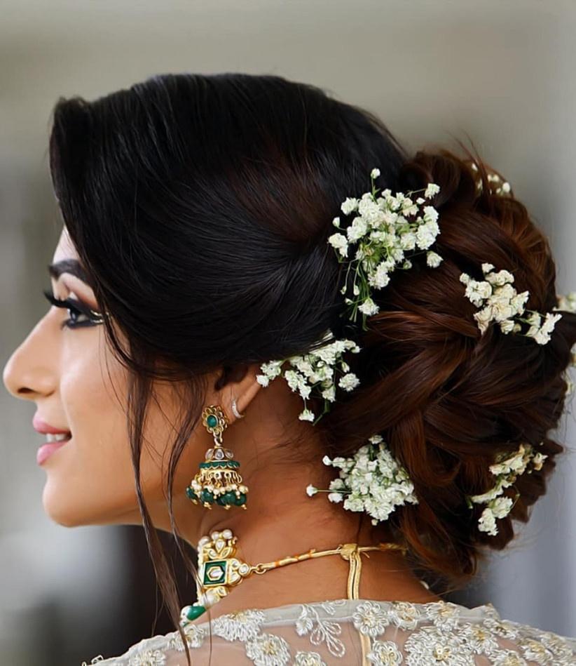 modern-pearl-bun-indian-reception-bridal-hairstyle-for-saree | WedAbout