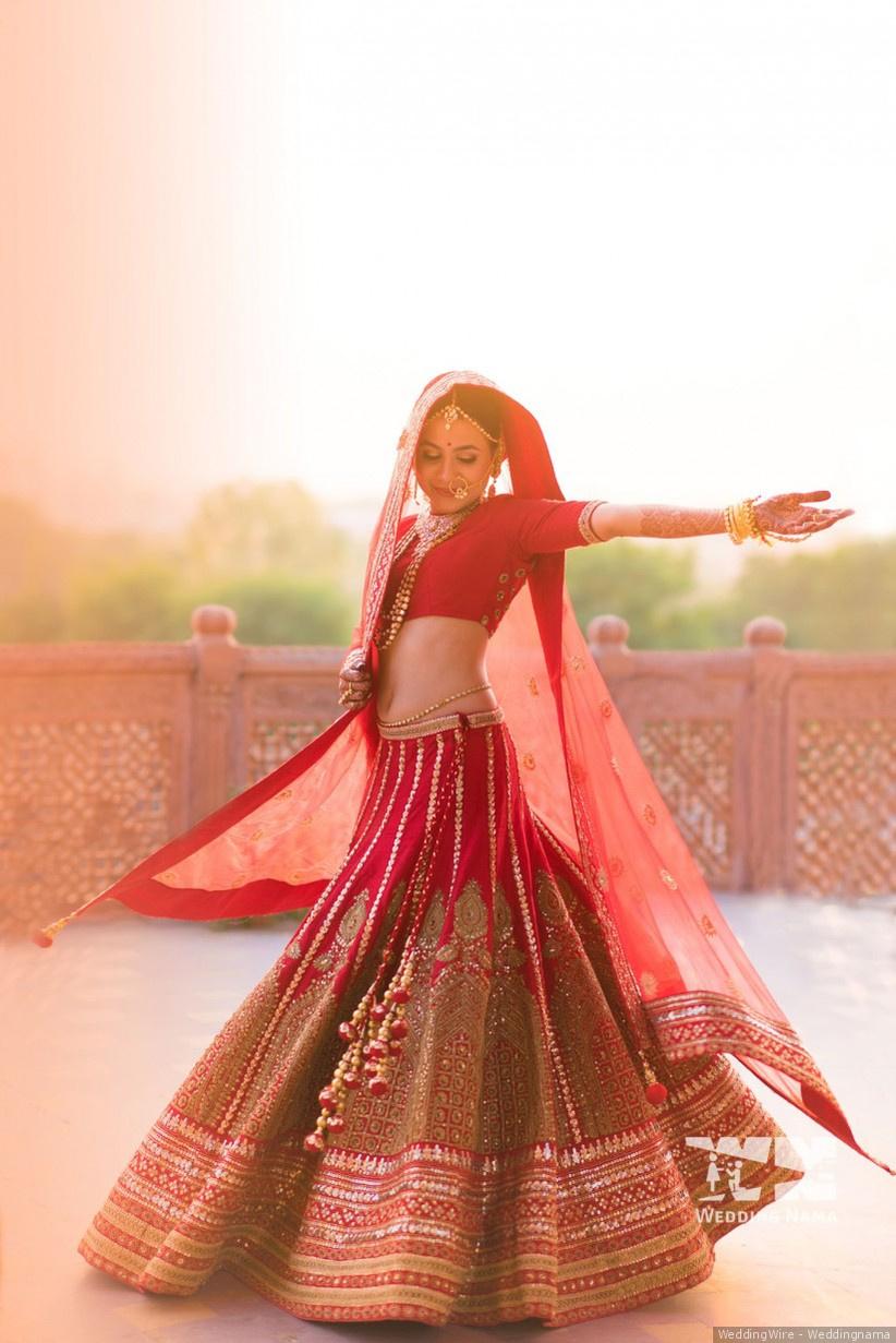 Yellow One Sleeves Sequins Choli With Tiered Lehenga And Belt Bag -  Babeehive