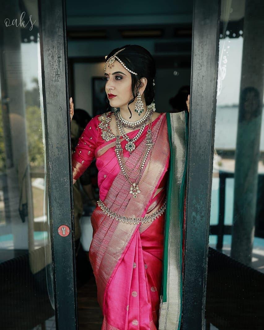 Portrait of a South Indian woman wearing jewelry and sari Stock Photo -  Alamy