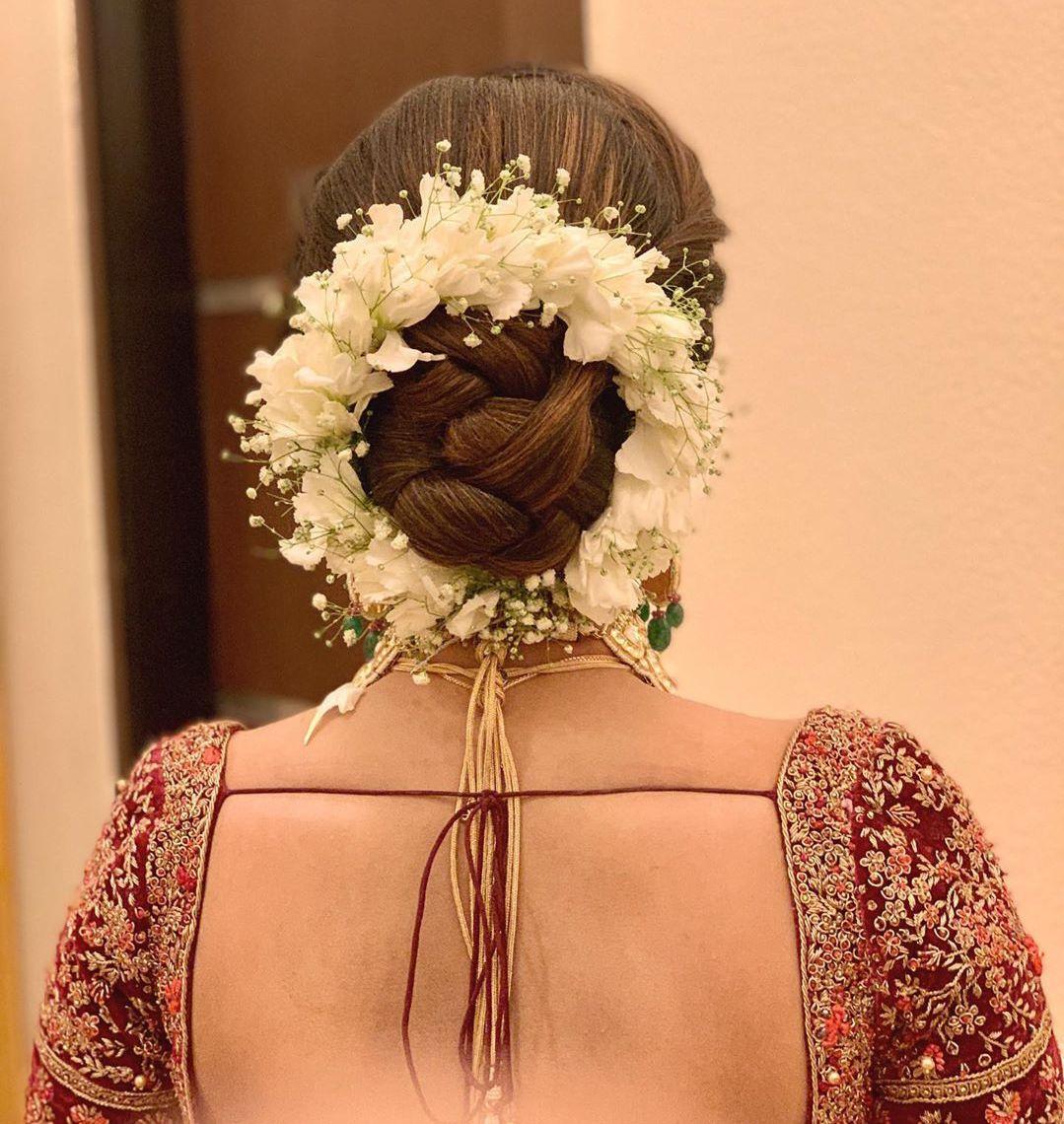 Trending Bridal Bun Hairstyle With Flowers For Wedding