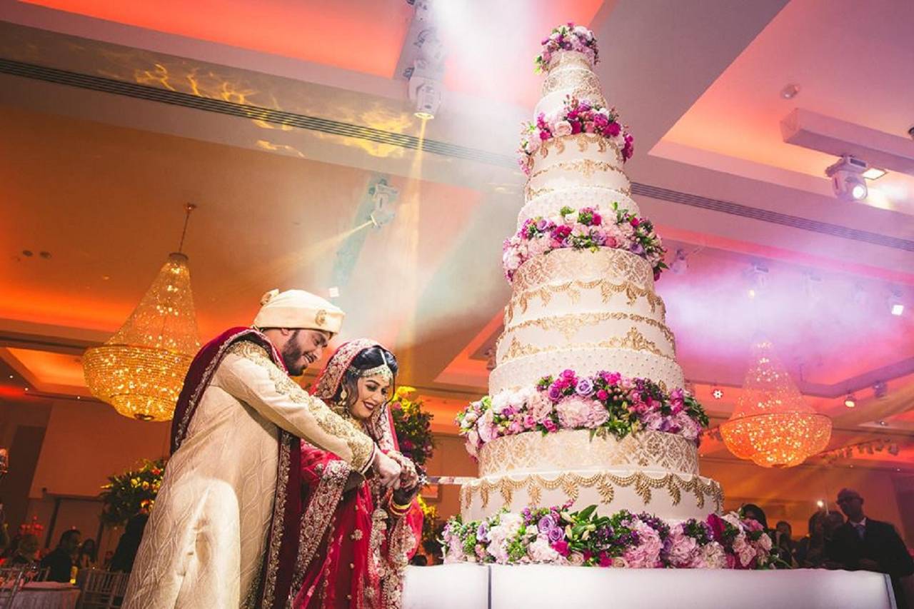 Indian couple cutting cake moment. | Photo 261235