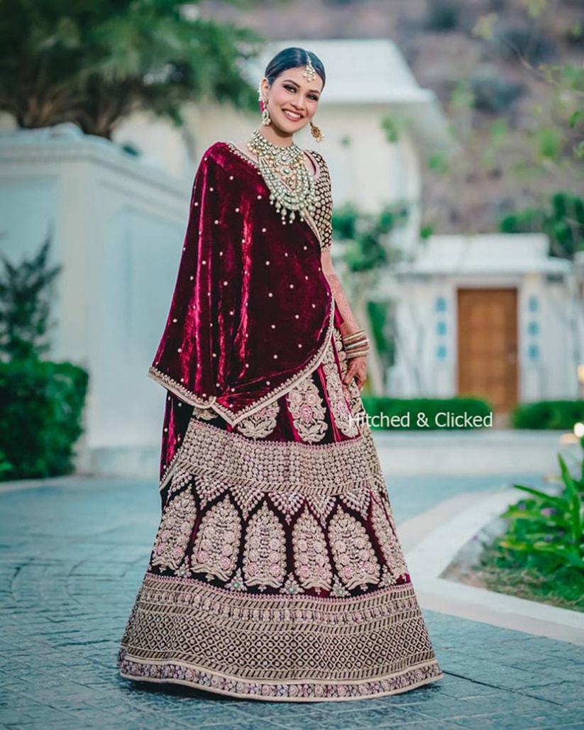 WINE MAROON CLASSIC LEHENGA SET WITH PATTERNED ZARI EMBROIDERY PAIRED WITH  A MATCHING DUPATTA AND ALL OVER 3D EMBROIDERED FLORAL DETAILS. - Seasons  India