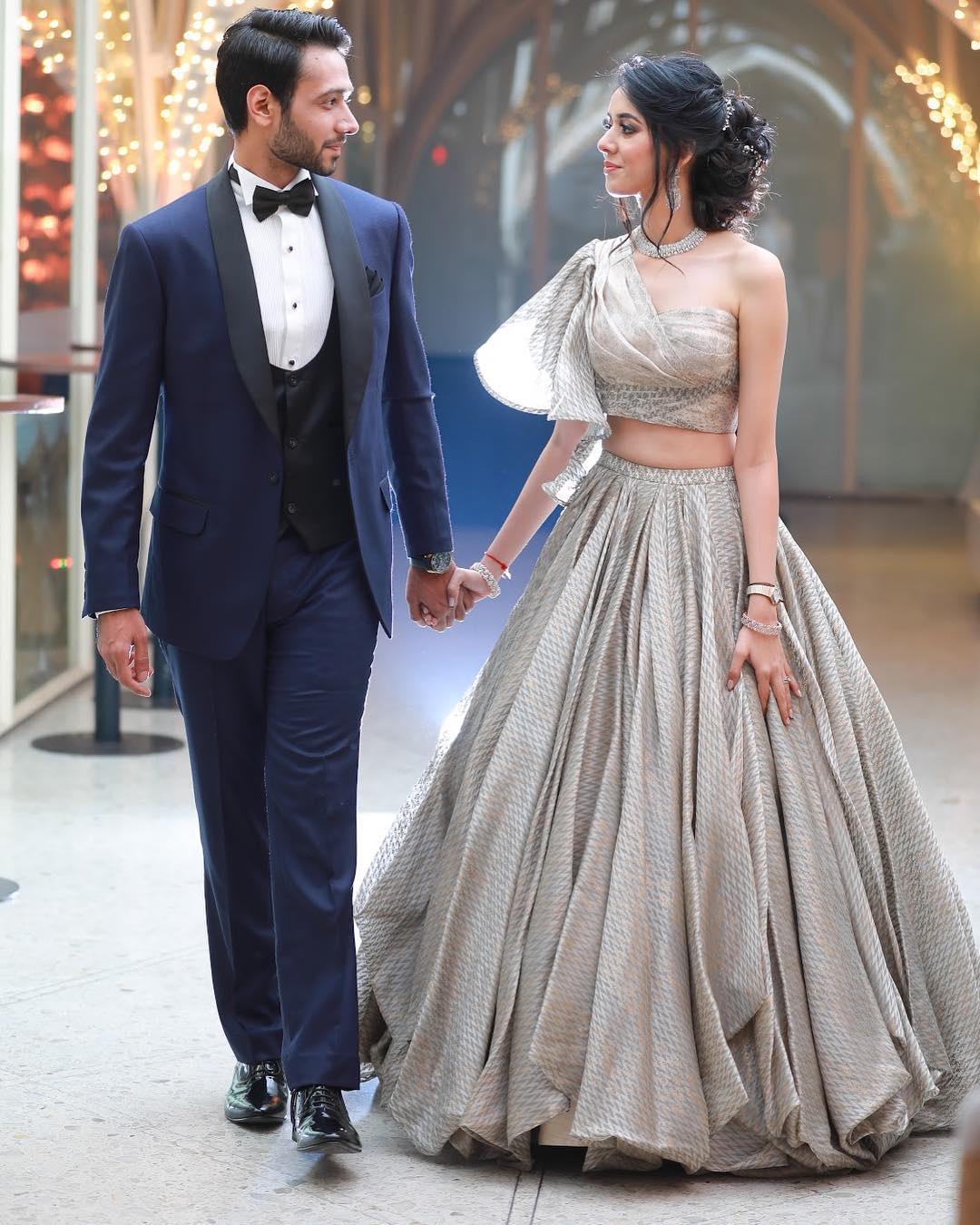 Photo of Pretty off shoulder blouse with silver lehenga