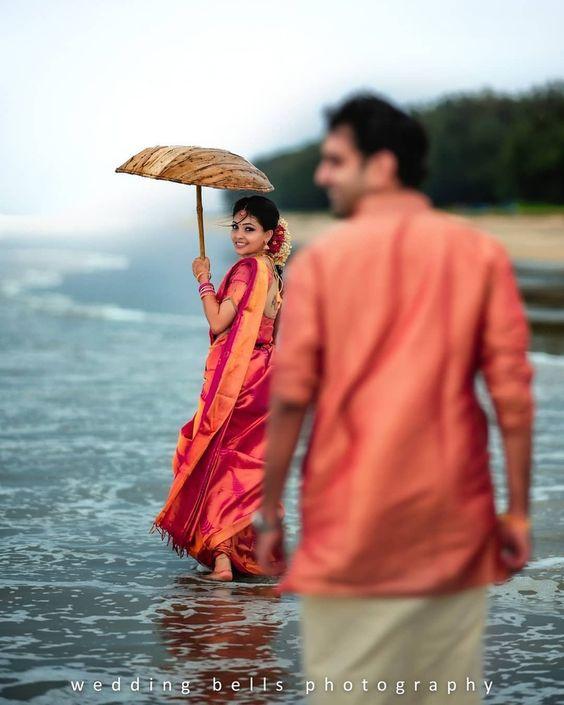 Indian couple posing during beach side pre-wedding celebration. | Photo  85204