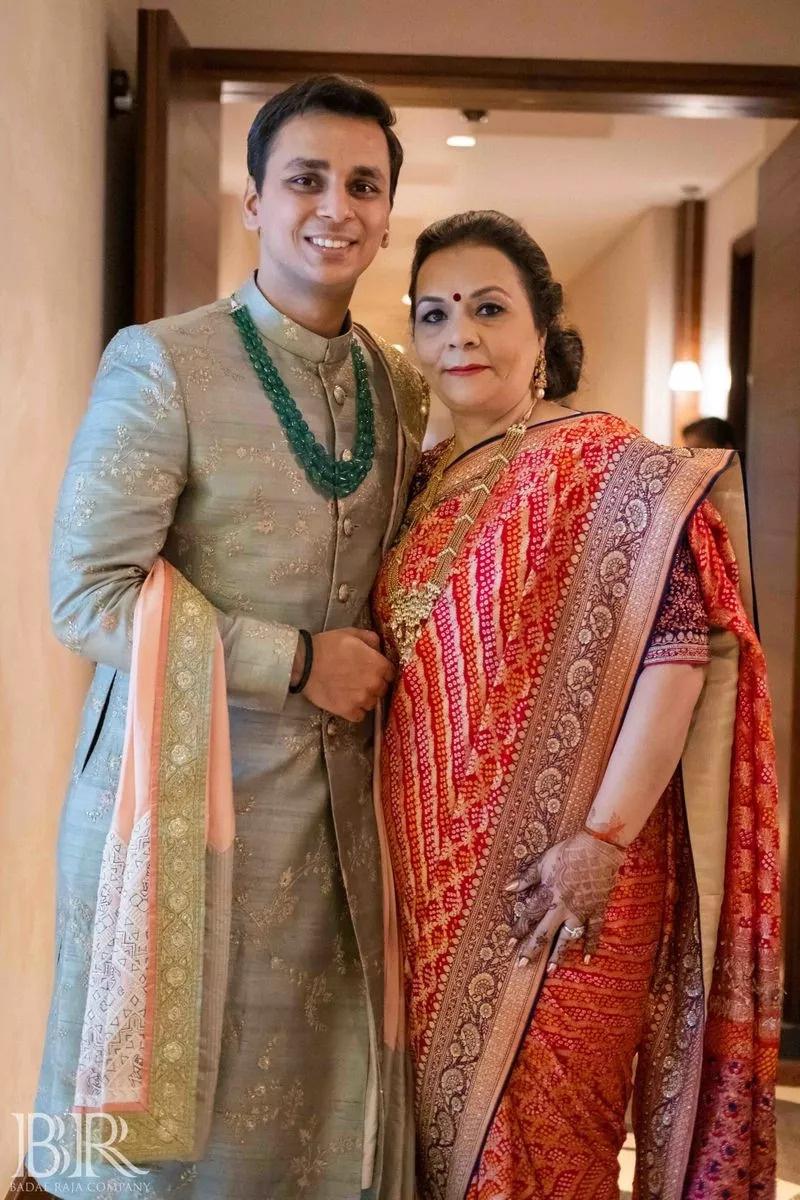 Indian bride being assisted with pink bridal saree. | Photo 260246