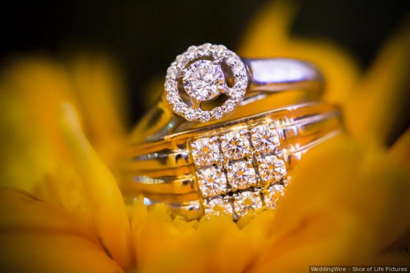 Closeup of indian woman hands wearing golden ring praying and • wall  stickers flower, turmeric, yellow | myloview.com