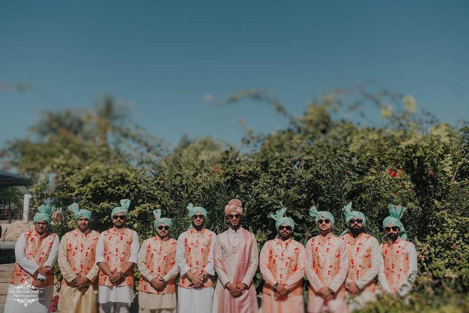Groomsman photo in floral outfit