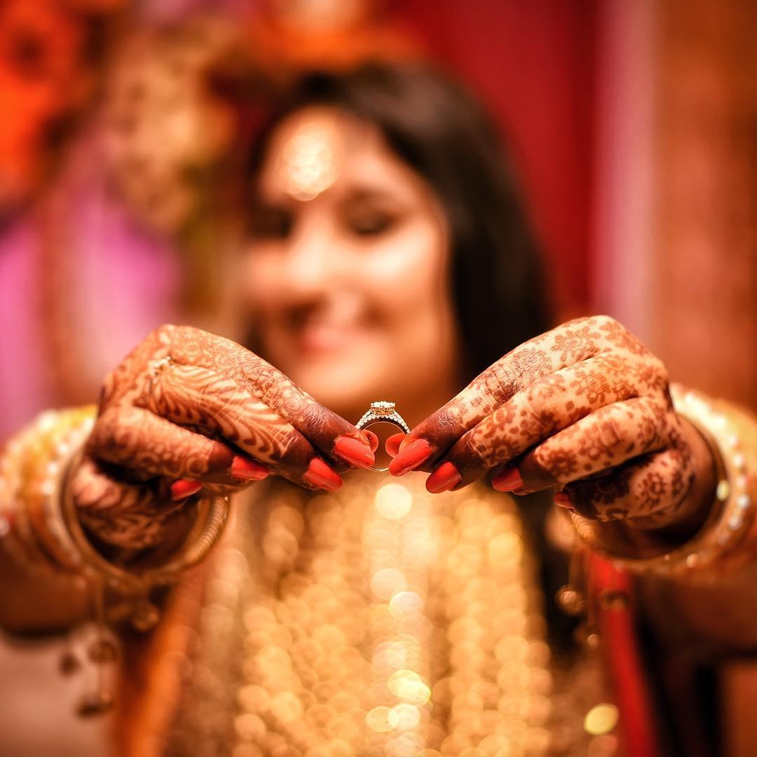 Photo of Romantic couple shot showing off rings