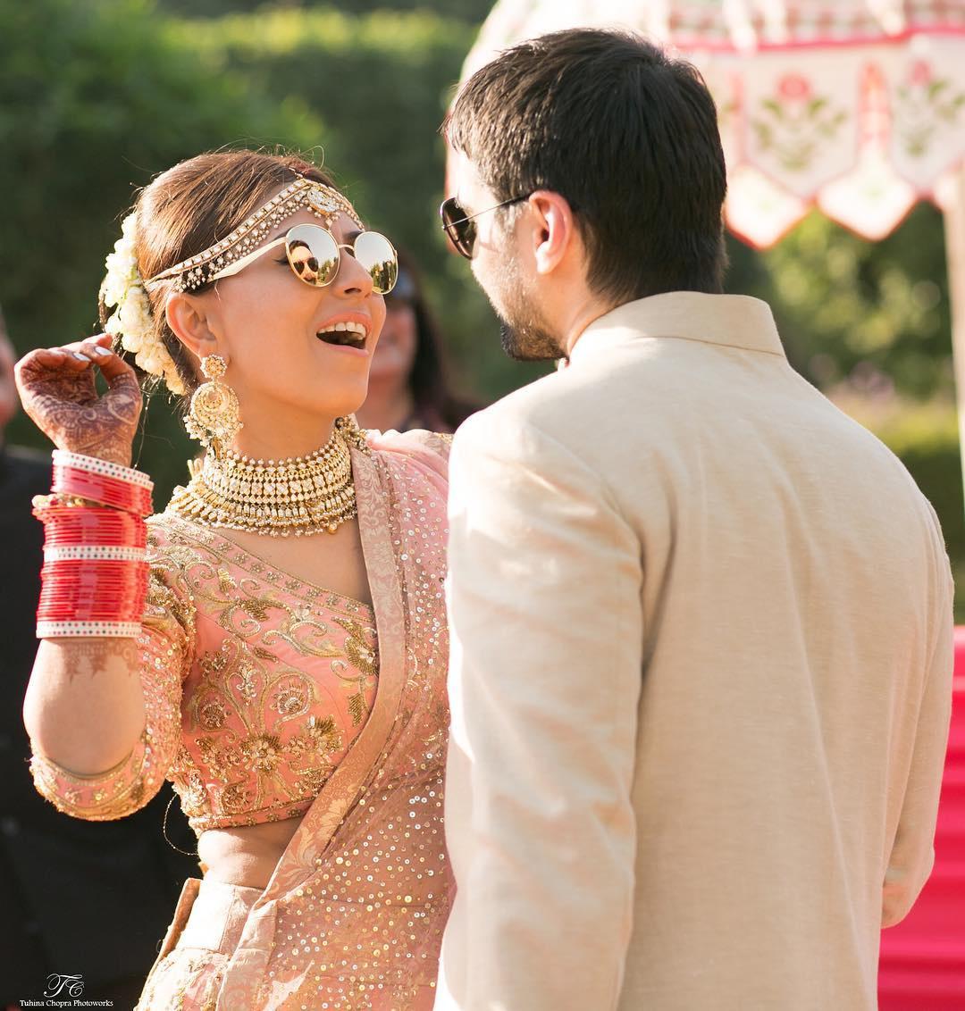 Photo of Bride in light grey and peach bridal lehenga