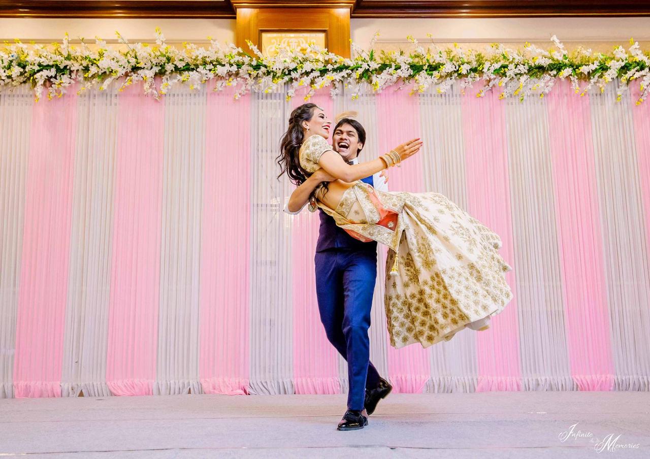 Photo of A royal sikh couple posing on their wedding day.