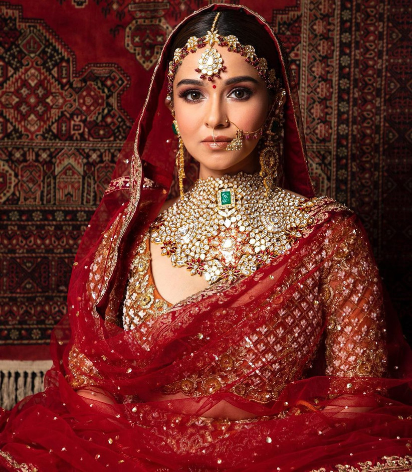 Green bridal jewellery with red lehenga on sale