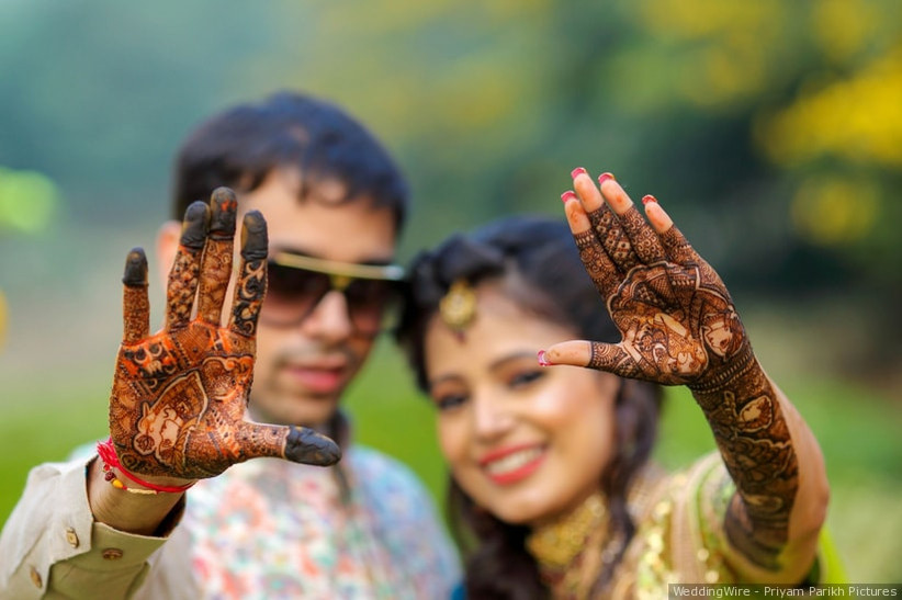 Intricately designed, this brilliant mehndi tattoo completely covers your palm.