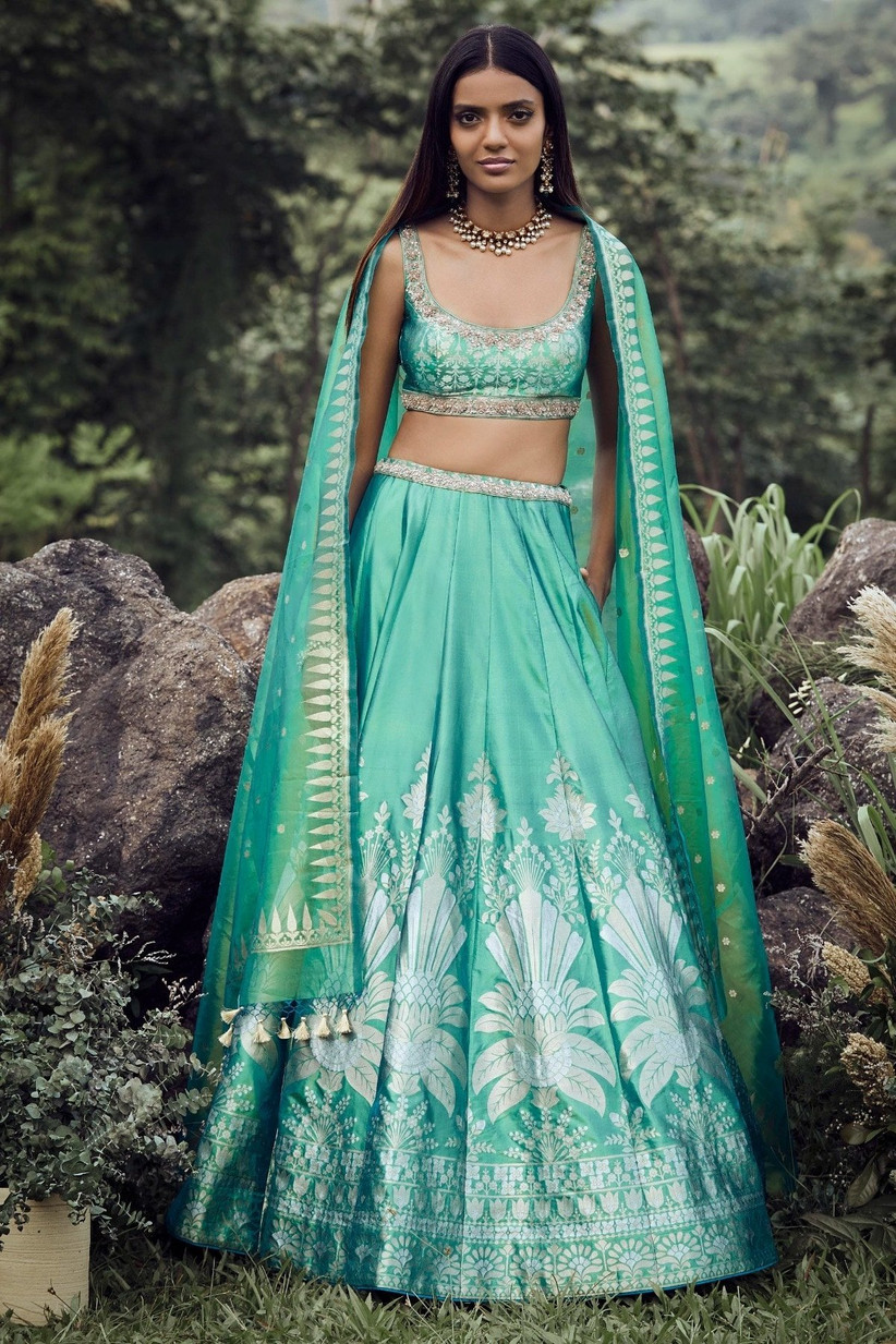 Photo of Engagement look with light blue lehenga and chunky silver jewellery